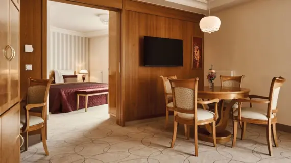 Interior of a room with a dining table and chairs.