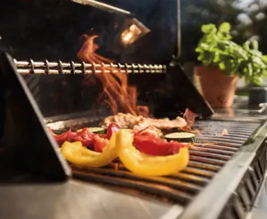 Eating on a barbecue with flames