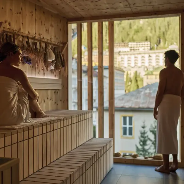 A man and woman in a sauna.