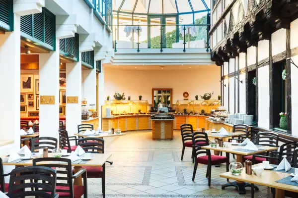 A restaurant with tables and chairs.
