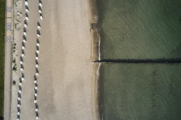 A beach with sand and water