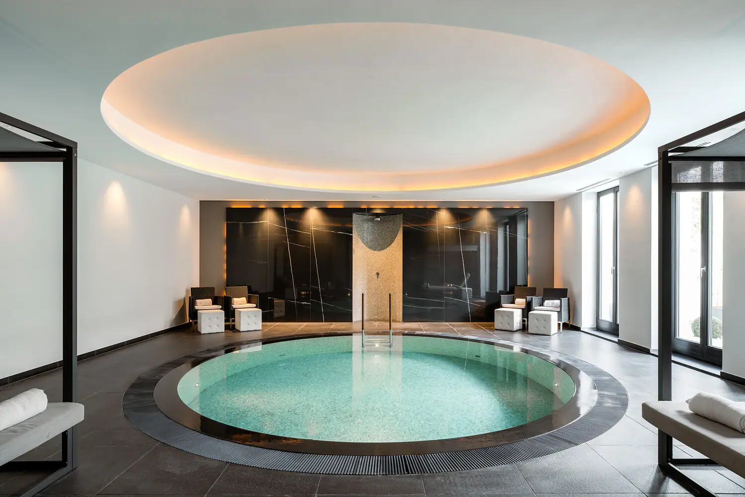 Indoor pool with a round swimming area.