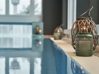 Indoor pool with candlestick and candles.