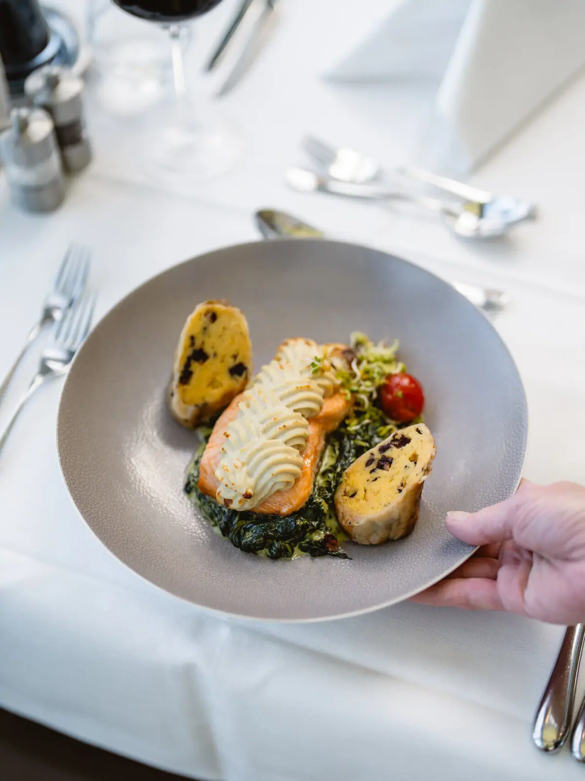 A plate of artfully arranged food on a table.