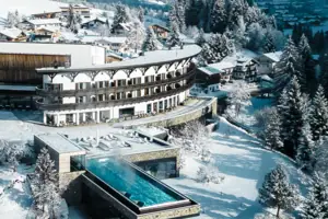 A building with a swimming pool in the snow