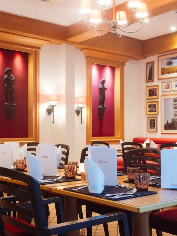 A room with tables and chairs.