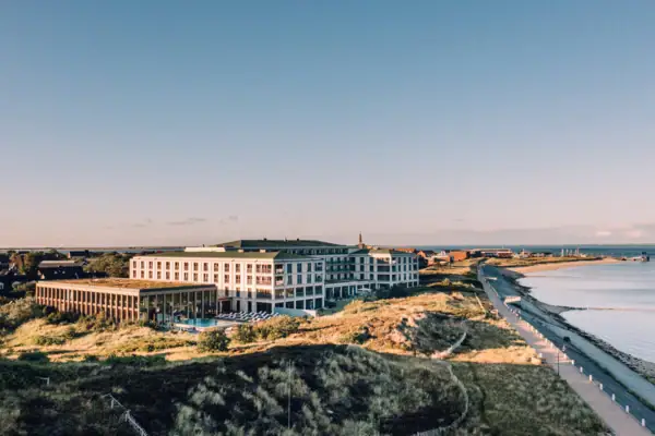 A large building next to a body of water.