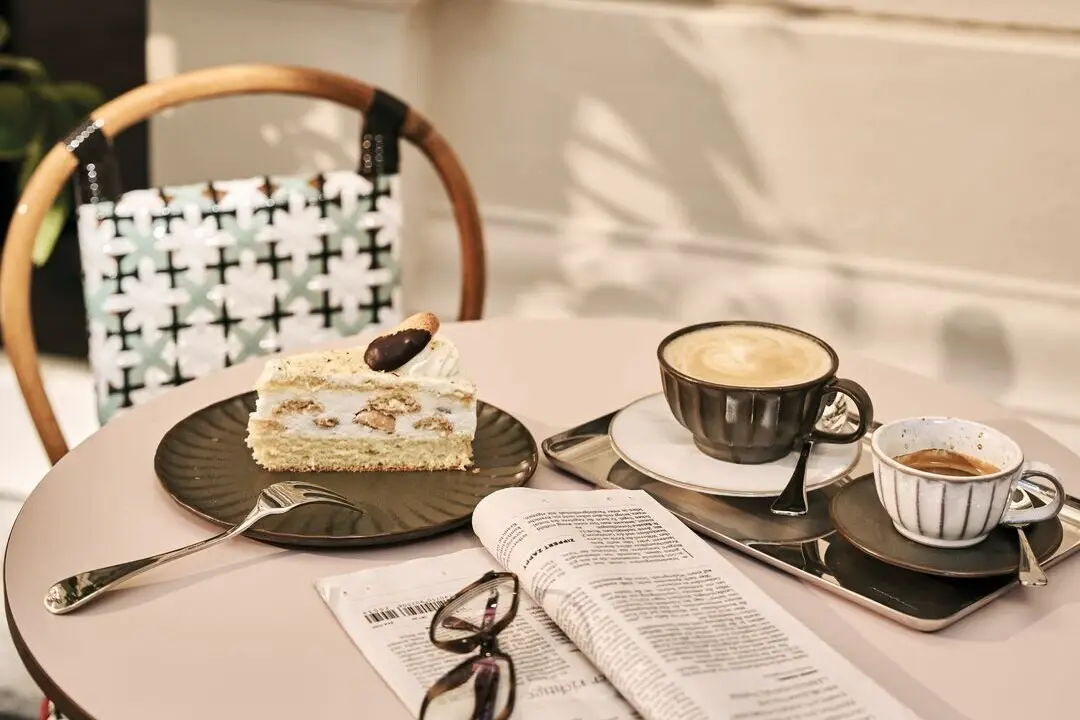 Coffee and homemade cake at the Straubinger Café in Bad Gastein with traditional Austrian coffeehouse atmosphere.