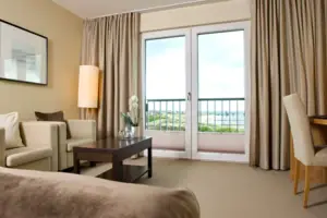 Hotel room with balcony and sofa