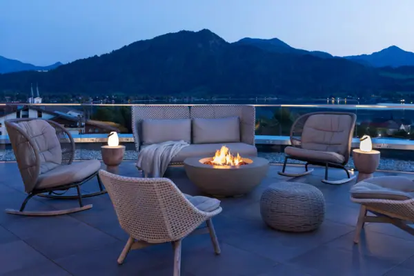 Evenings on the terrace Patio with fireplace and chairs on a balcony