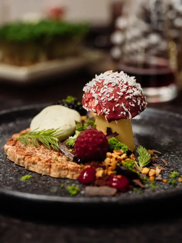 A plate of artfully arranged dessert on a table.