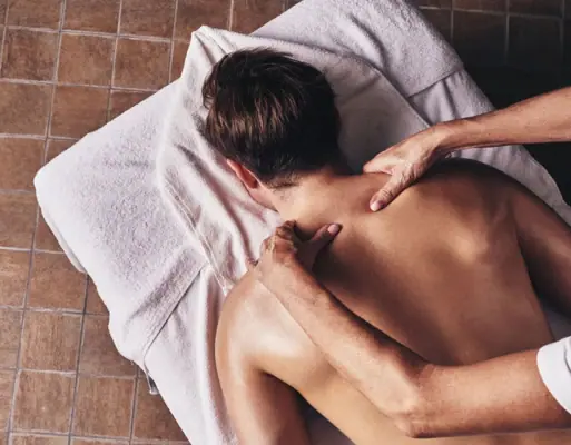 sPA treatments One person receives a back massage.