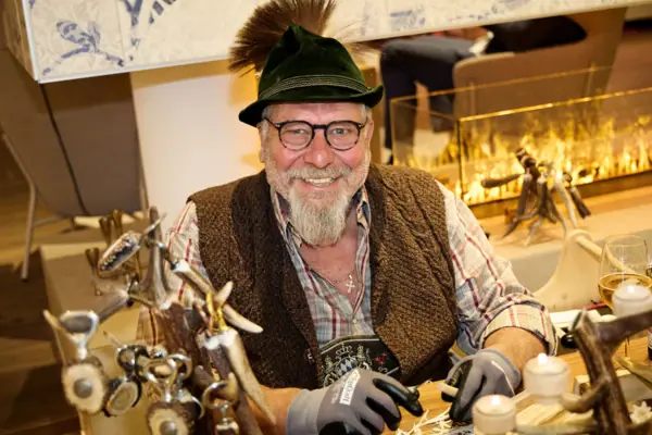 A man wearing a hat and gloves.