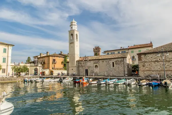 Lazise Boats in the harbour under a cloudy sky