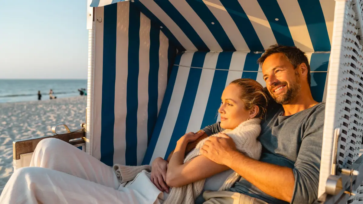 A seaside holiday with A-ROSA A man and a woman are sitting in a beach chair.
