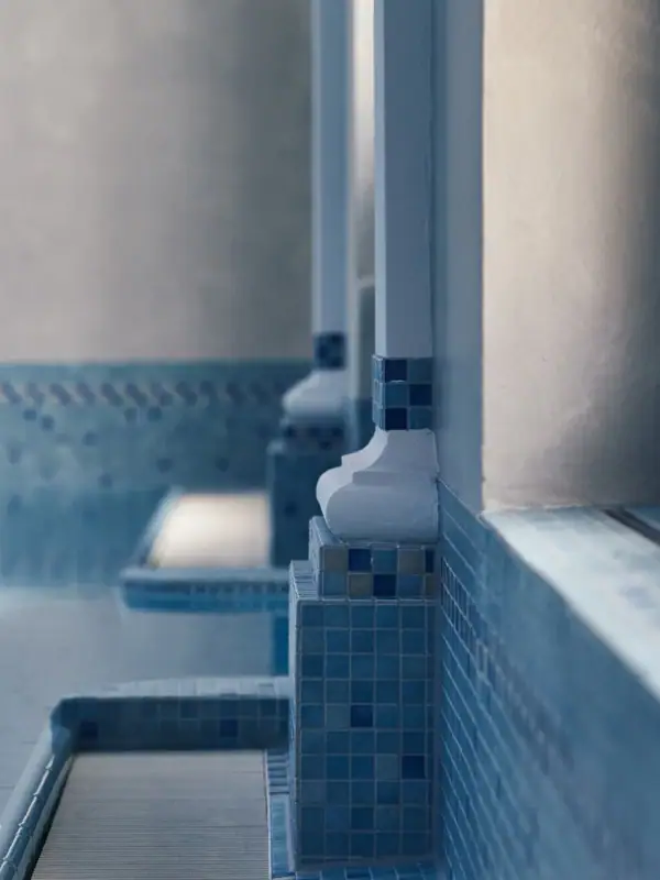 A row of blue tiles on a wall.