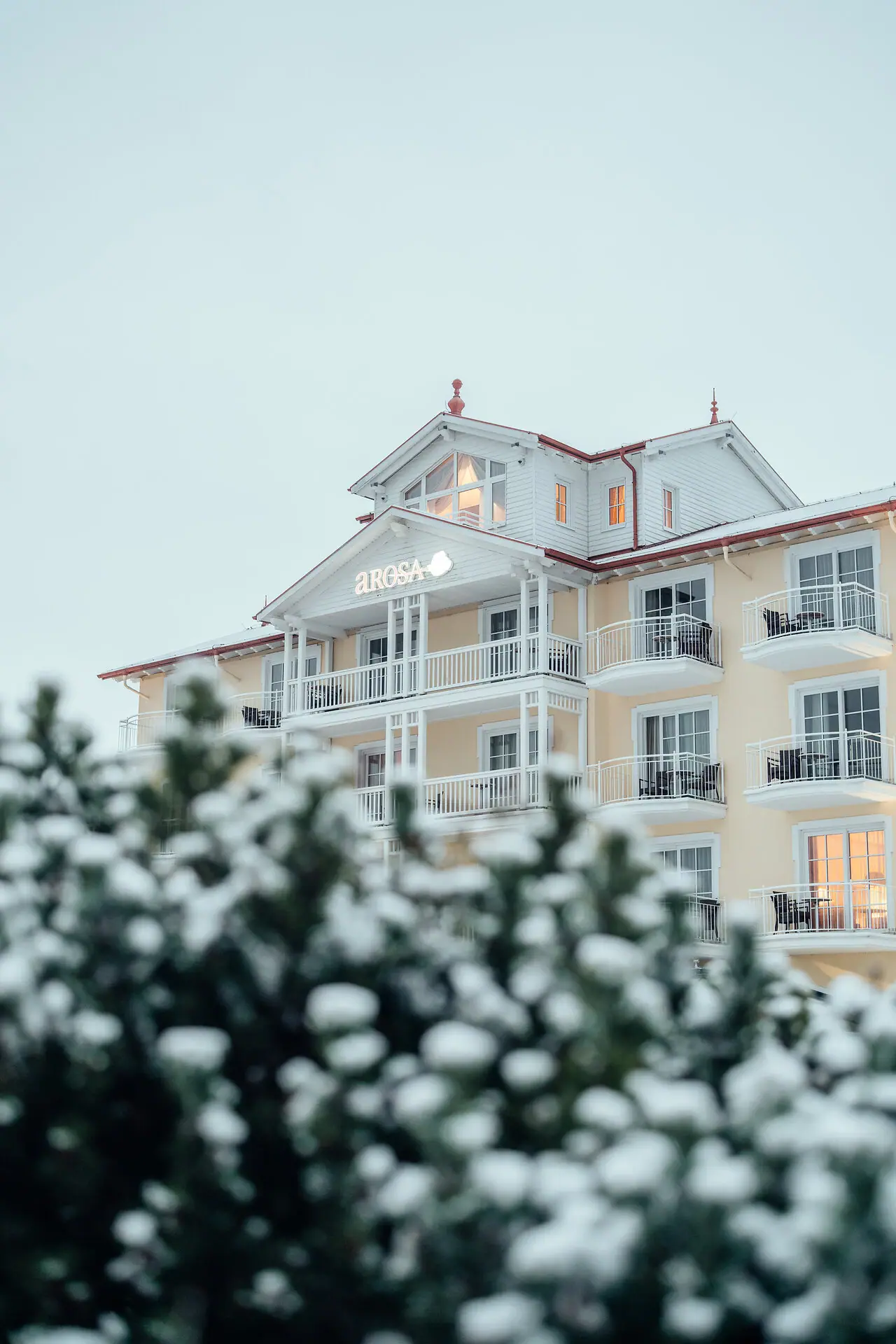 A building with snow on the ground in winter.