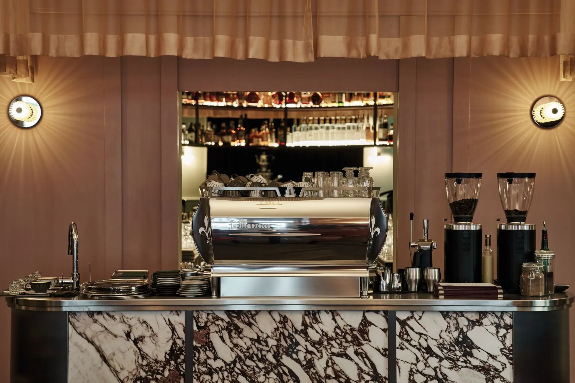 Elegant Straubinger Café bar interior in Bad Gastein with marble counter and traditional Viennese coffee ambience.