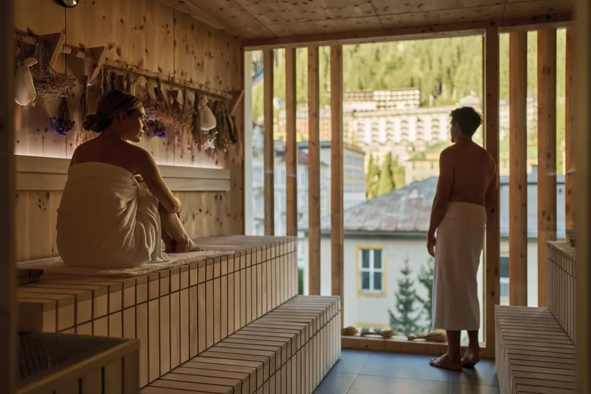 A man and a woman in a sauna.