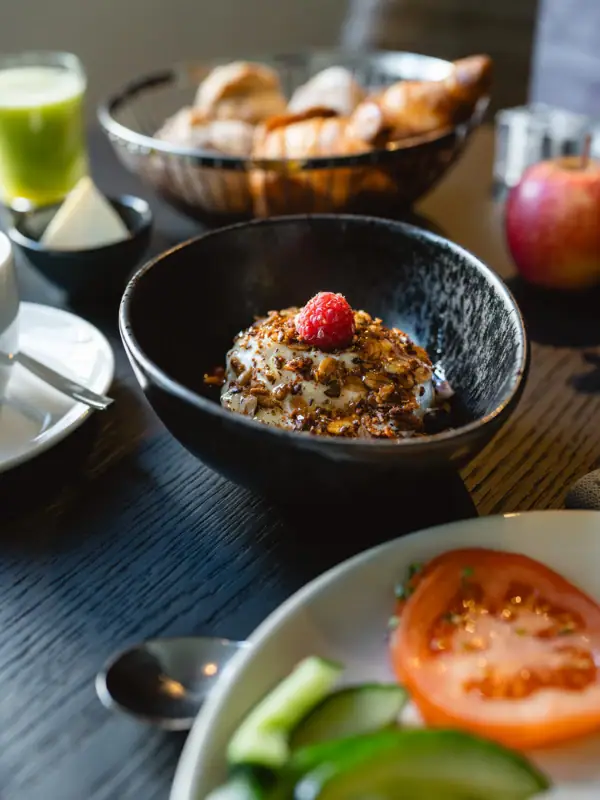 A bowl of food on a table.