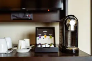 Coffee machine and coffee cups on a table
