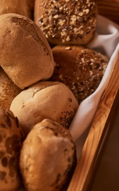 A basket of freshly baked bread in a wooden box.