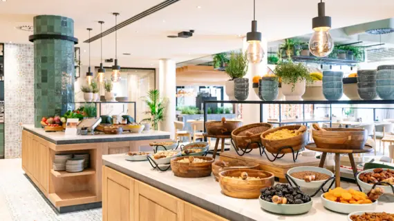 Buffet with a selection of dishes on the counter in an interior room.