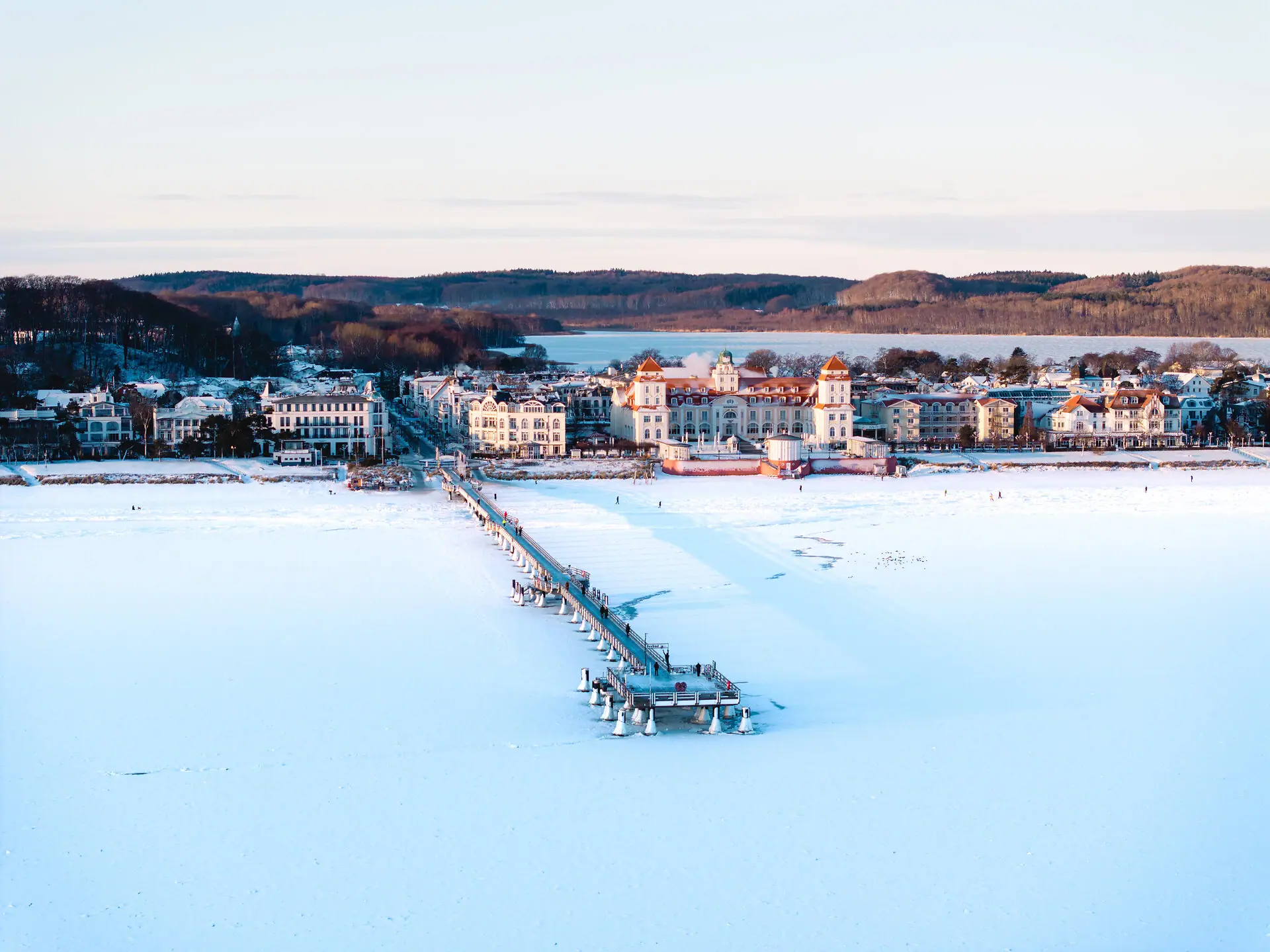 A bridge over a frozen lake in winter.