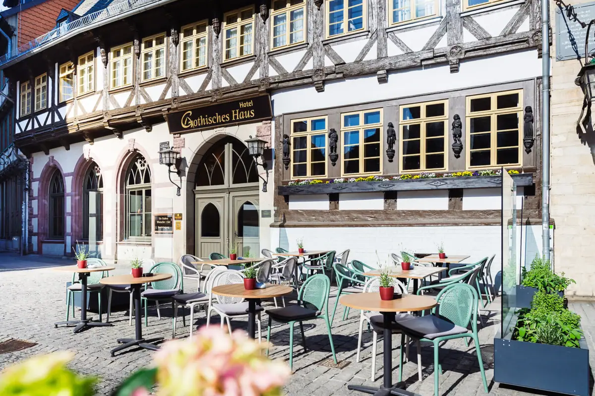 The A-ROSA Hotel Wernigerode, with tables and chairs outside.
