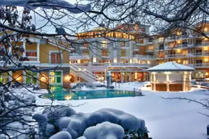 A building with a swimming pool in the snow.