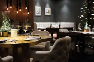 A restaurant with tables and chairs.
