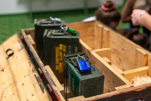 A group of green metal boxes with locks.