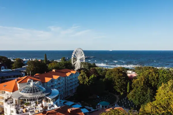 Ferris wheel next to a body of water