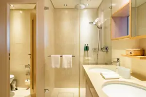 Bathroom with shower and washbasin