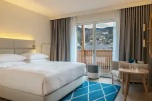 sleeping area Hotel room with a bed and a chair