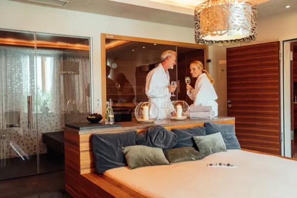 Two people in a private spa suite at the A-ROSA Ifen Hotel in Kleinwalsertal.