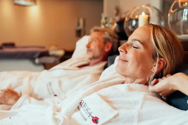 A woman and a man in bathrobes.