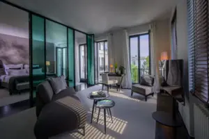 A room with a sofa and a table.