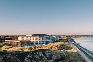 A large building next to a body of water.