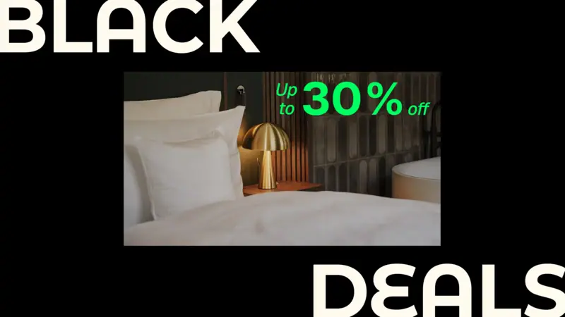 A bed with a pillow and a lamp.